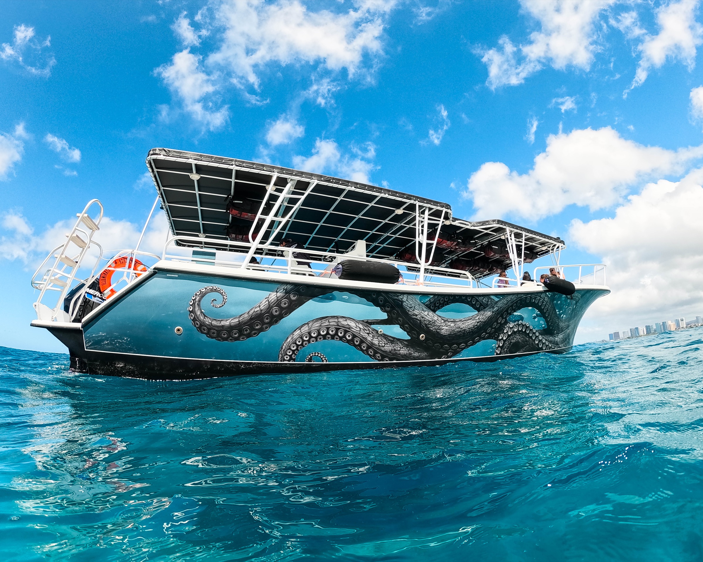 Illuminate’s custom octopus hull artwork on the water